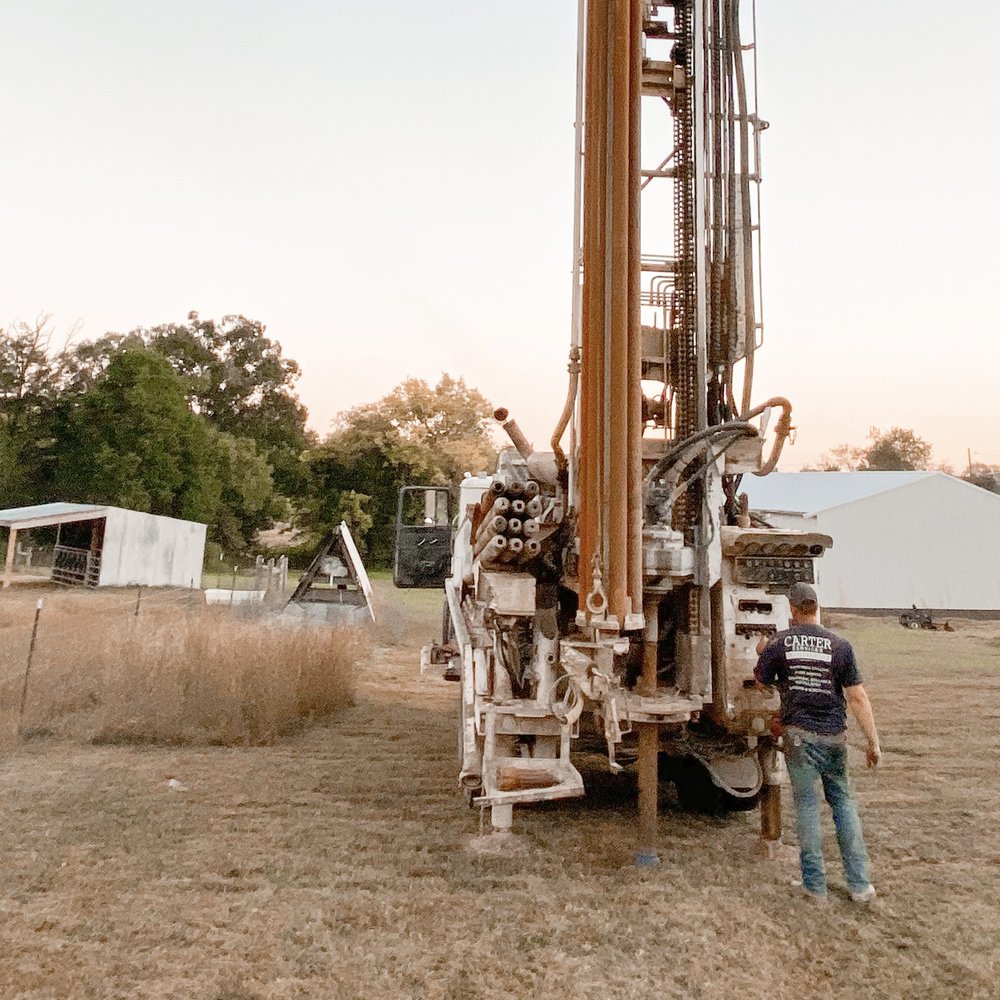 Water well drilling rig operating in Redbridge
